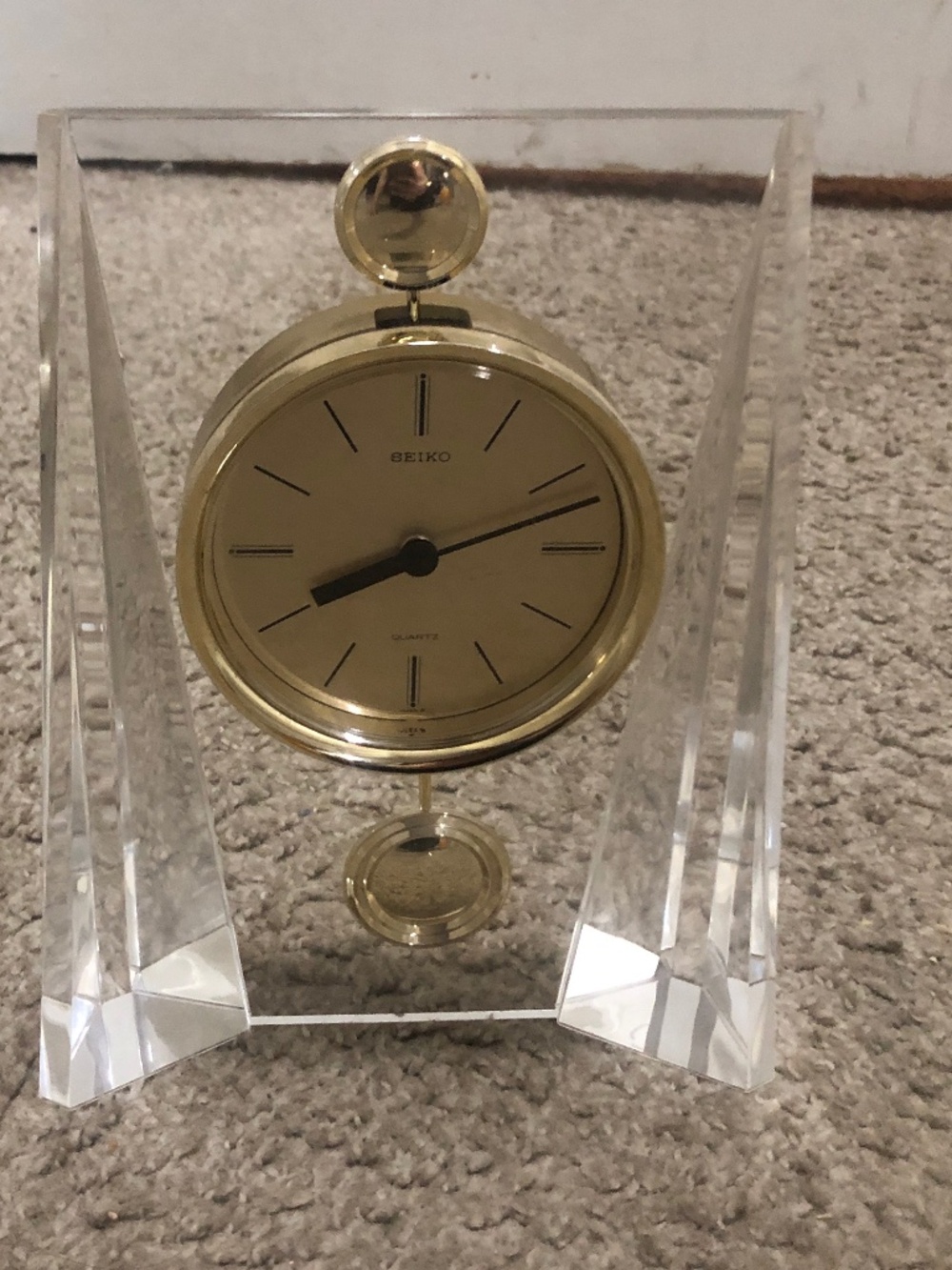 vintage Seiko lucite and brass mantel clock, likely manufactured in the 1970s